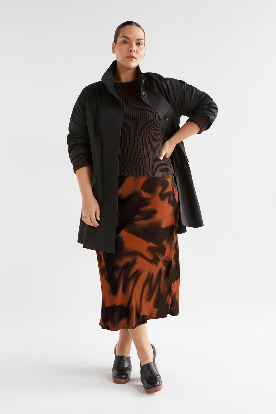 Quinn Midi Elastic Waist Bias Cut Print Skirt Model Curve Front with Jacket | TORTOISE SHELL PRINT
