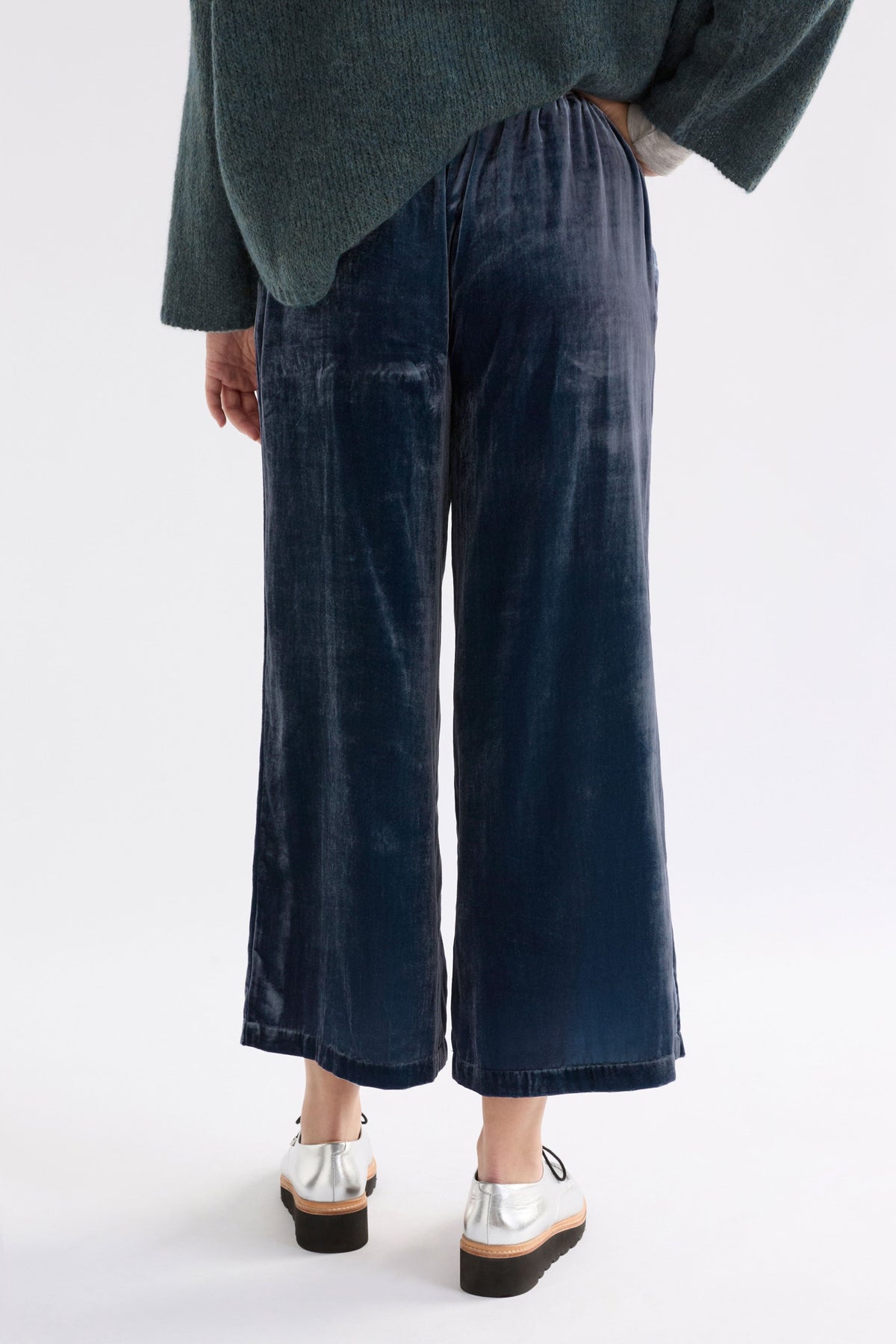 Suuri Velvet Wide Leg Elastic Waist Pant Model Angled Back | BLUE STEEL
