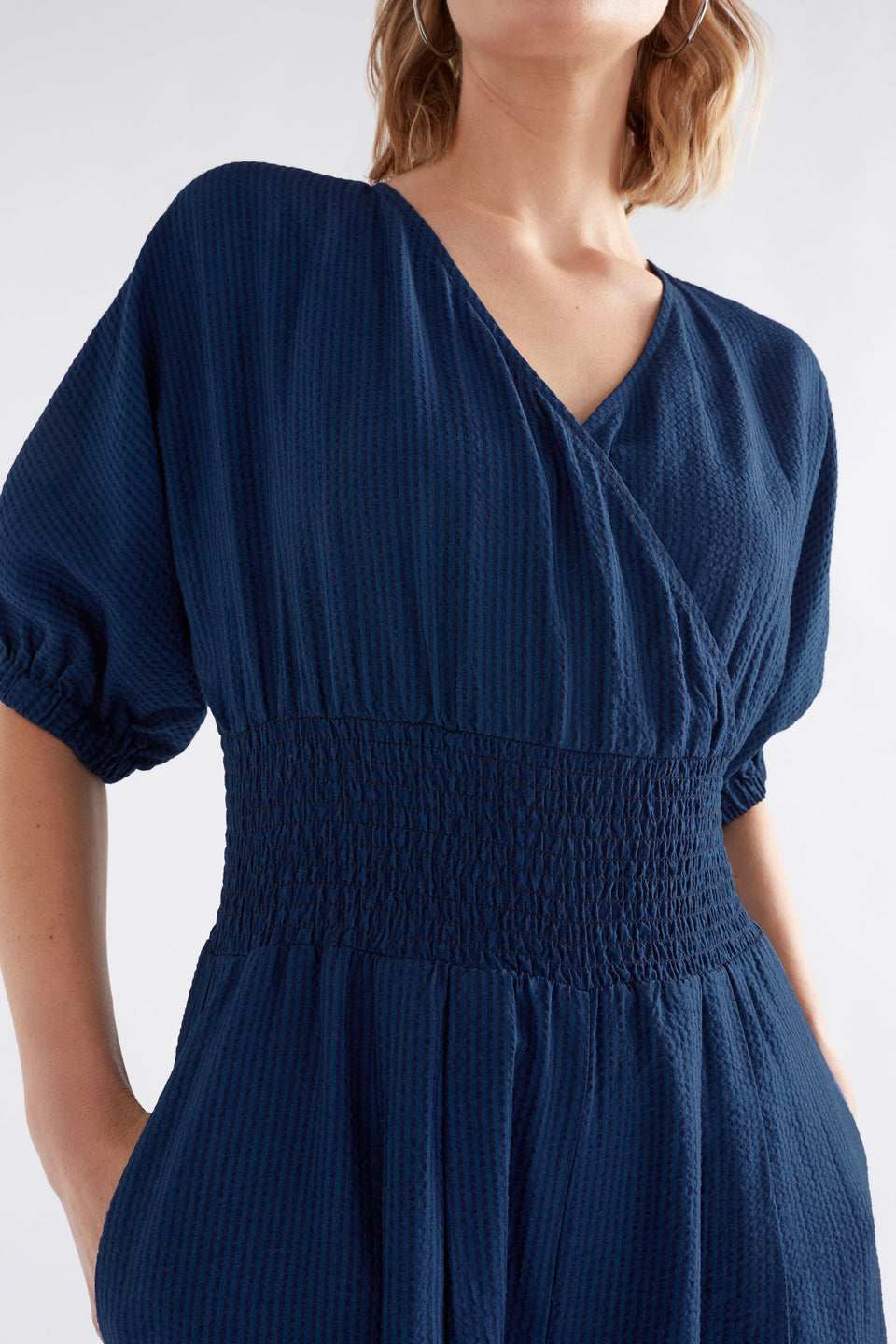 Stolt Seersucker Short Puff Sleeve Wide Leg Shirred Waist V-neck Jumpsuit ELK Model front detail | MID WASH