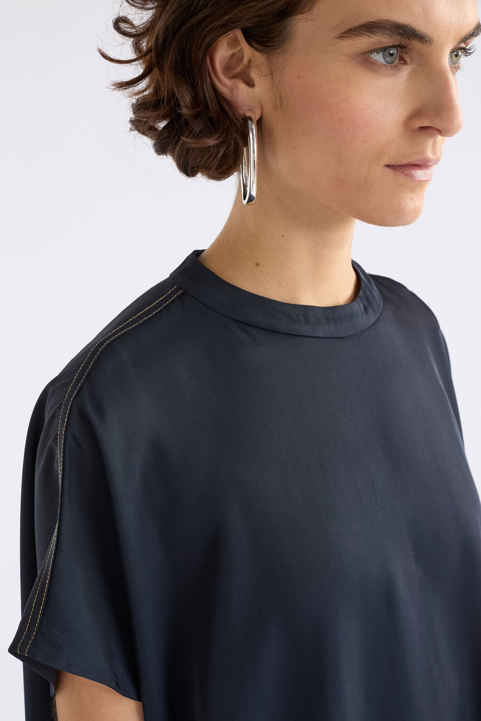 Hullu Relaxed Short Sleeve High Neck Top with Handkerchief Hem Model Front detail | NAVY