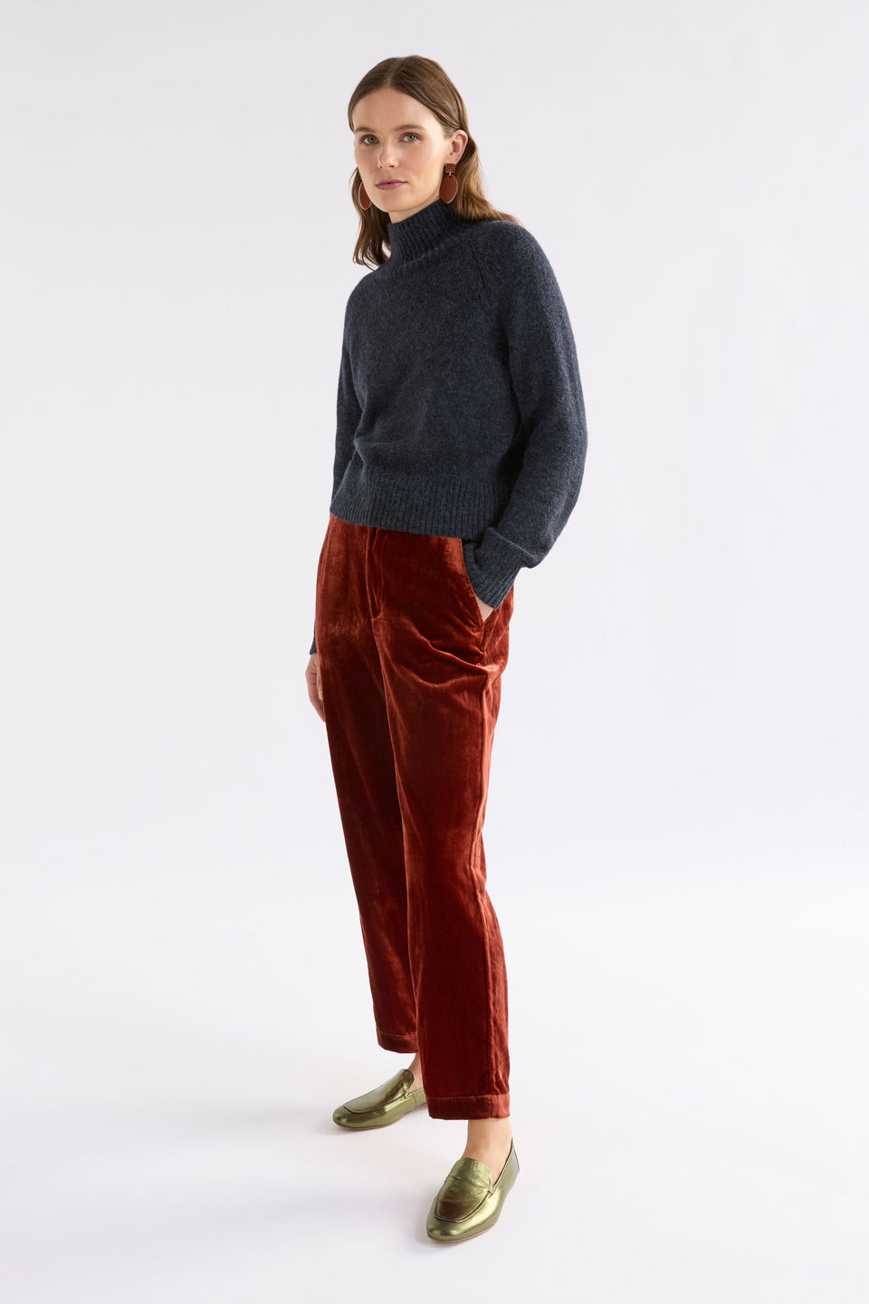 Suuri Flat-Front Waistband Tapered-Leg Velvet Pant Model Angled Front | SPICE