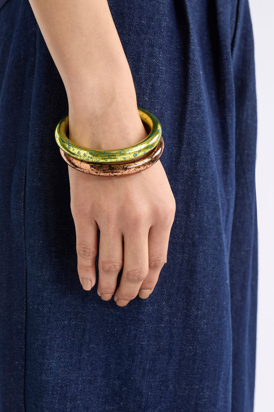 Oban Bangle Jewellery on model in stack with bronze | ARTICHOKE
