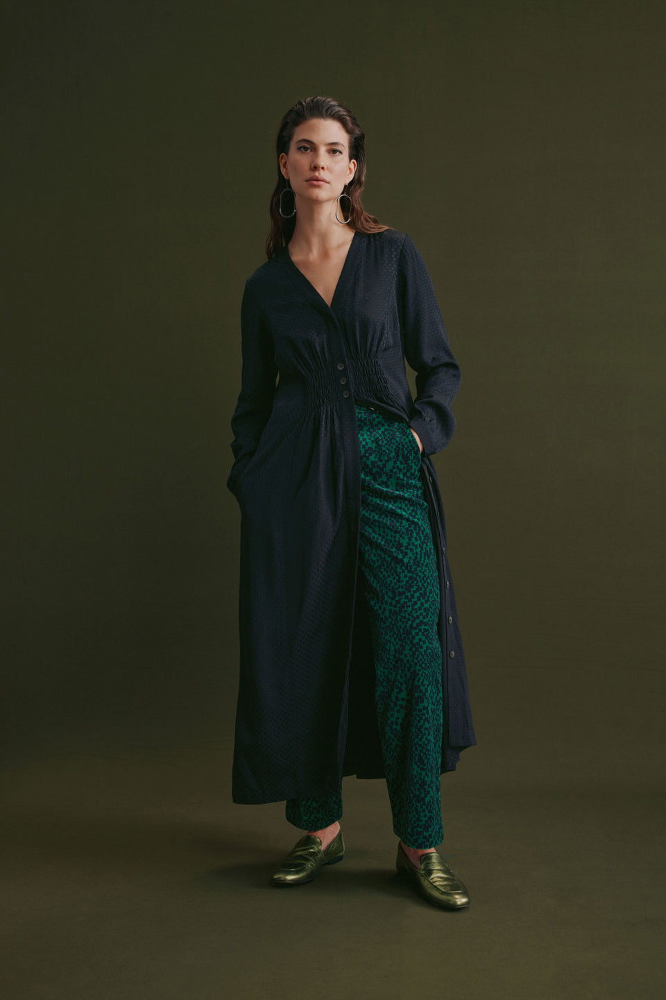 Atles High Waisted Tapered Leg Dark Green Pattern Cut Cord Pant Model Front Campaign with Dress | GREEN SINDA PRINT