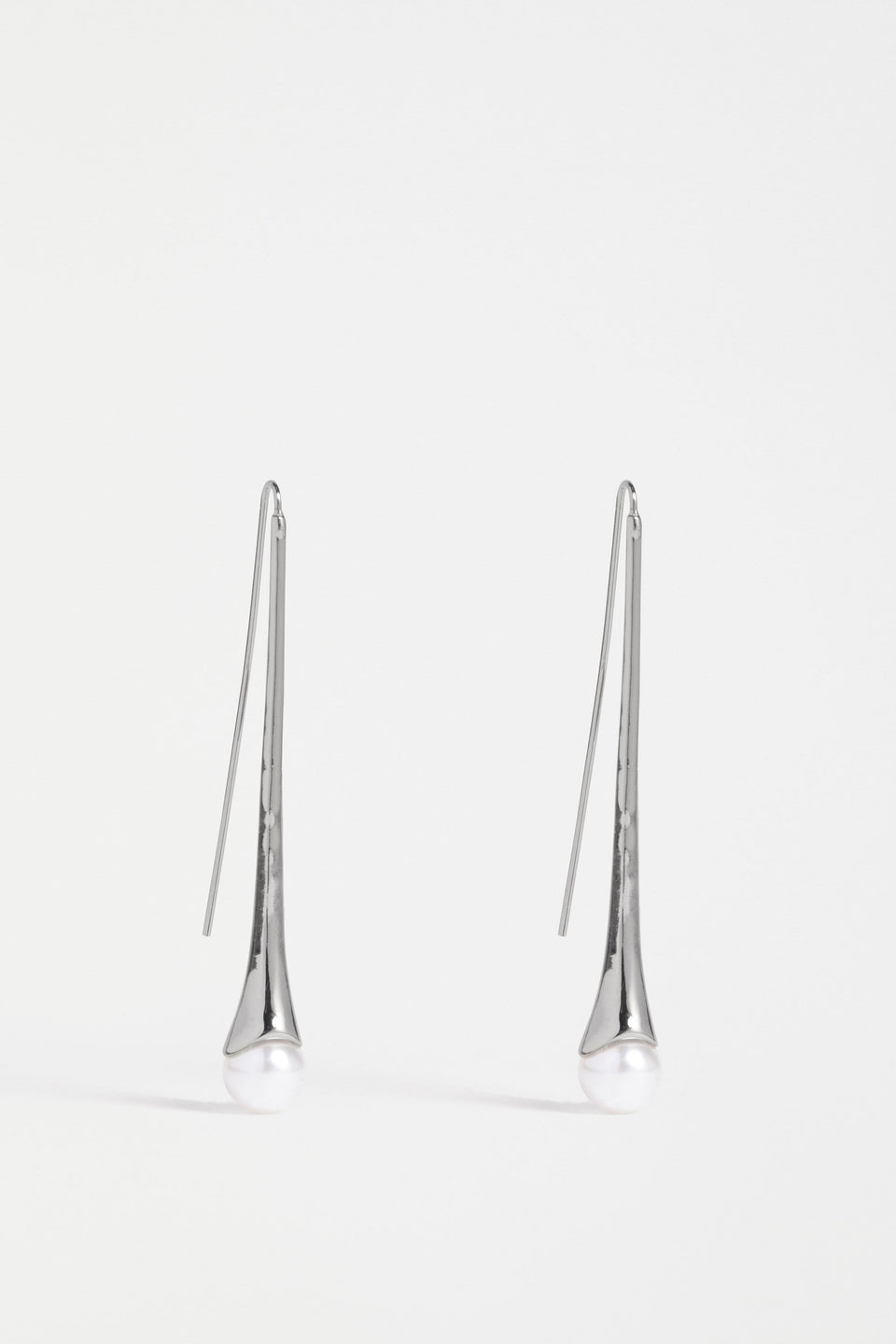 The Orbyn Drop Earring showcases an elongated stem with a faux pearl bead, offering a refined and elegant hook silhouette | GUNMETAL
