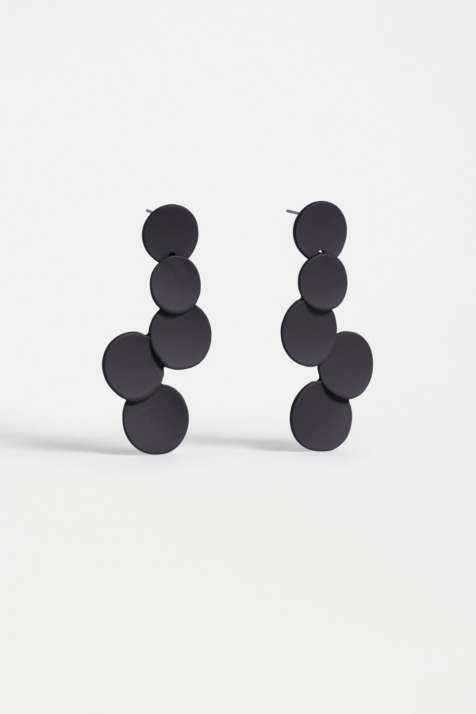 The Tallke Drop Earring features overlapping sculptural circles in an elongated form with a matte rubberised finish for playful impact ELK | BLACK