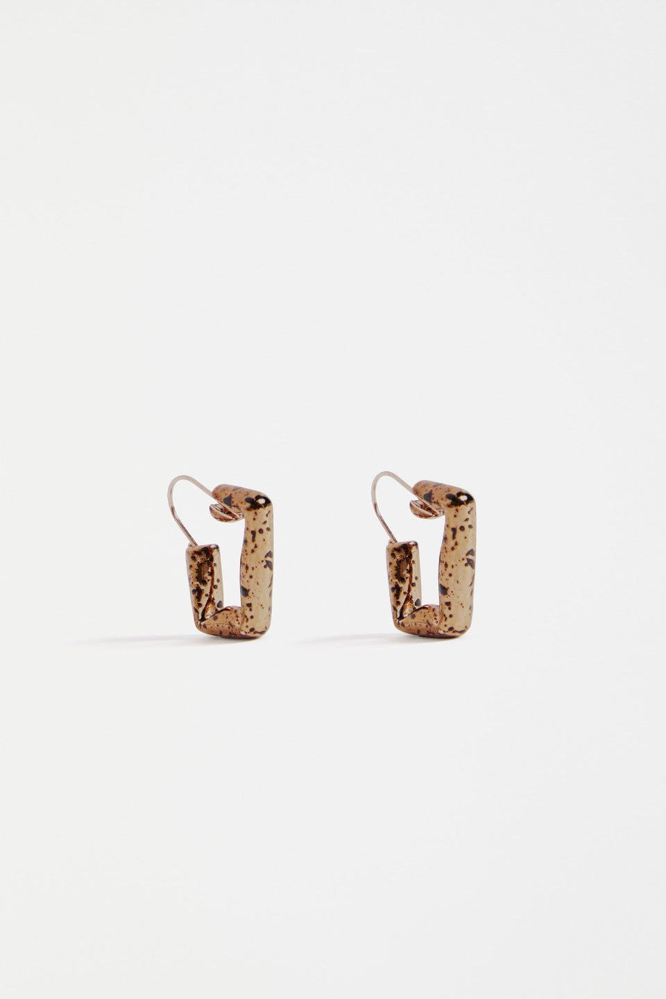 The Oban Square Hoop Earring features a bold geometric shape with a glistening bronze base and contrasting enamel splatter finish | BRONZE