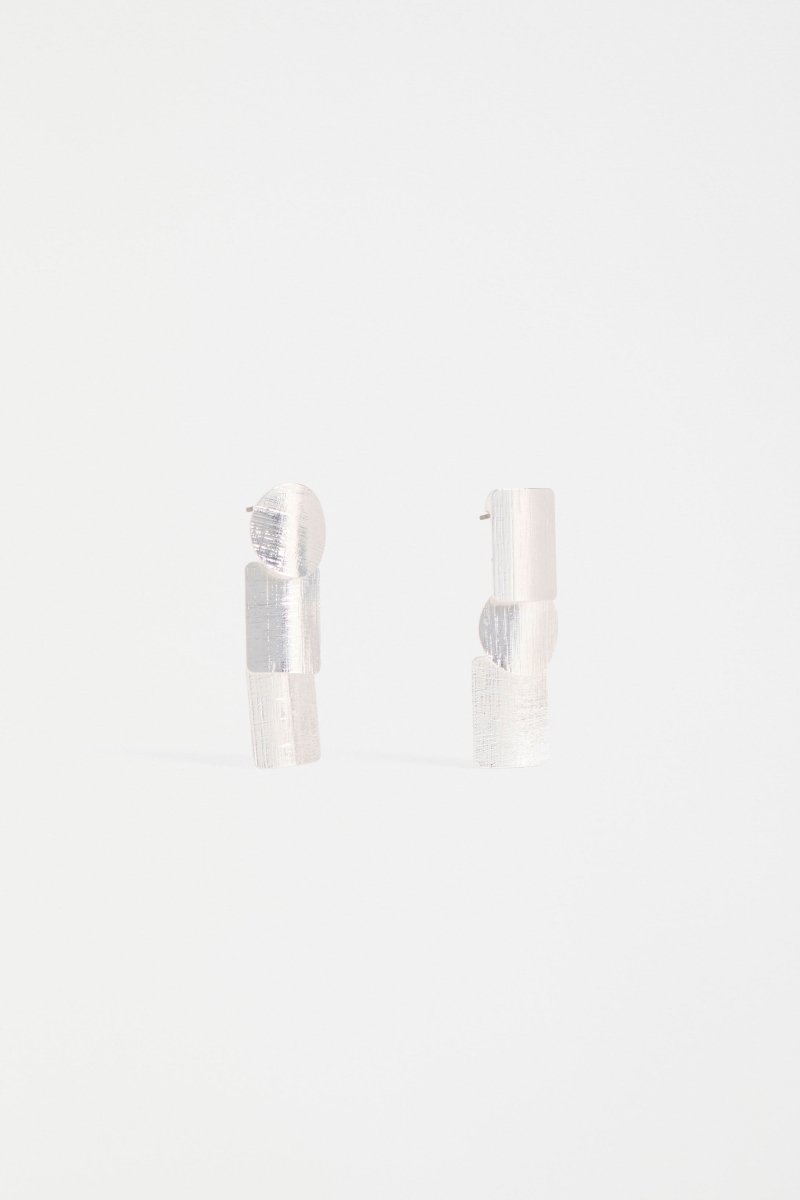 The Paerr Drop Earring features two rounded rectangles and a circle in a vertical row, creating a mid-sized sculptural drop style ELK | SILVER