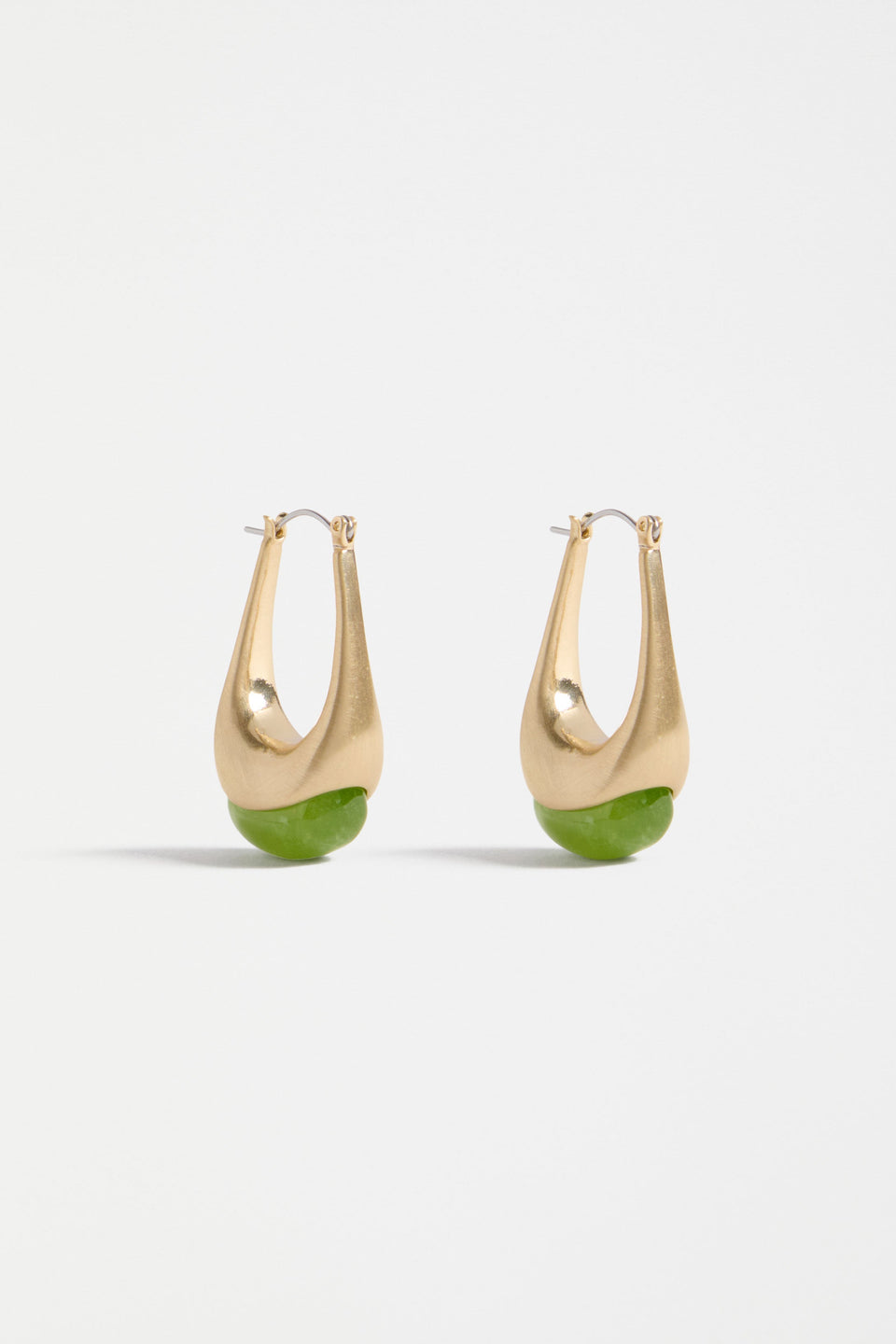 The Korvvo Long Hoop Earring features an elongated sculptural hoop with a coloured flecked glass bead, adding bold elegance to evening looks | CELERY