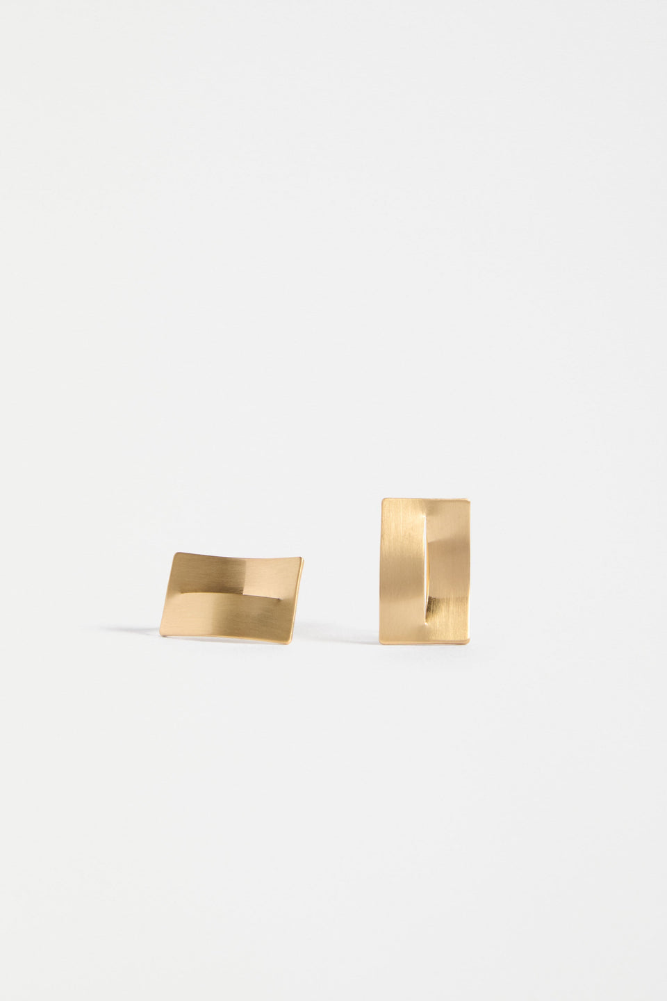 The Trel Stud Earring features a sleek rectangular shape with a folded cut-out detail, blending minimalism with sculptural edge | GOLD