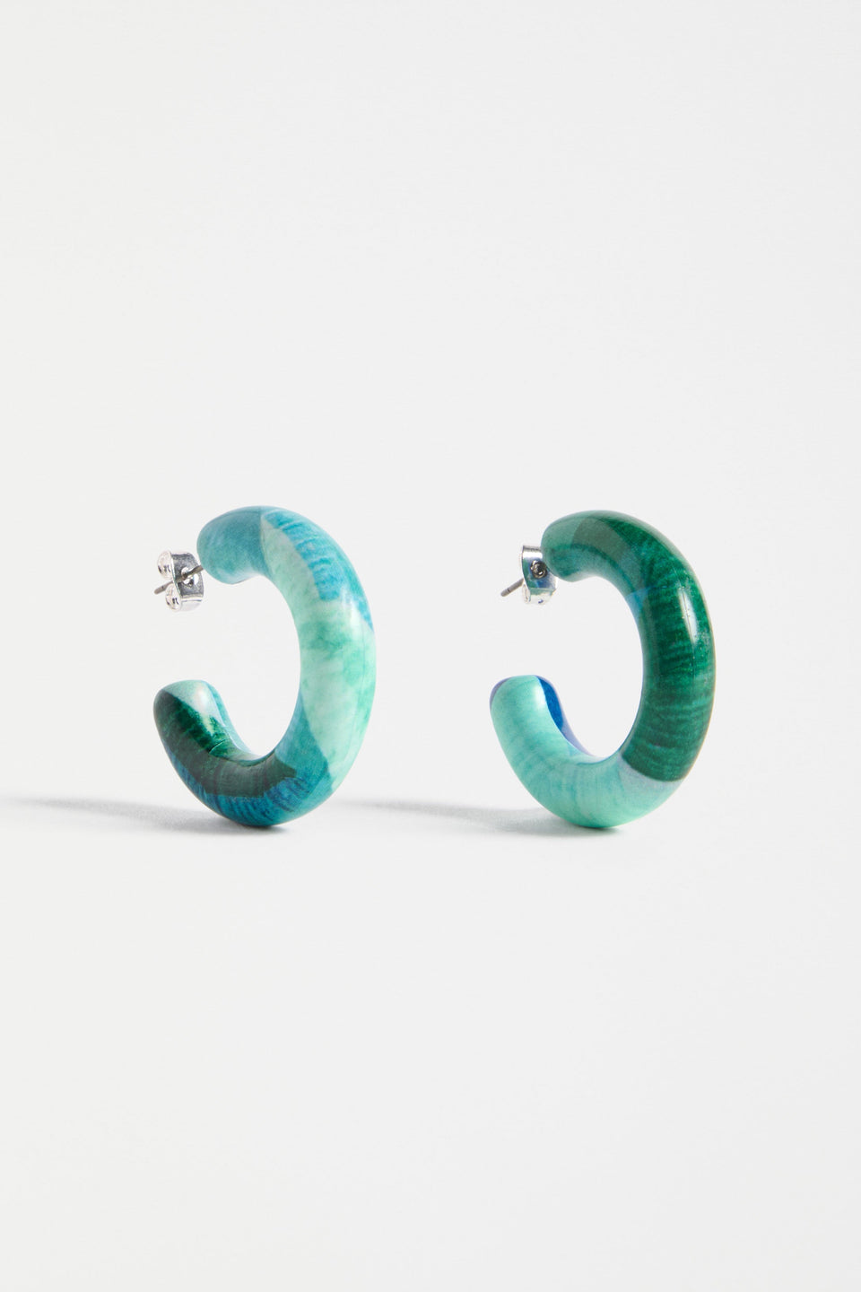 The Resso Hoop Earring features a mid-sized open resin hoop with a contemporary silhouette and playful all-over printed design | GREEN KOMI PRINT