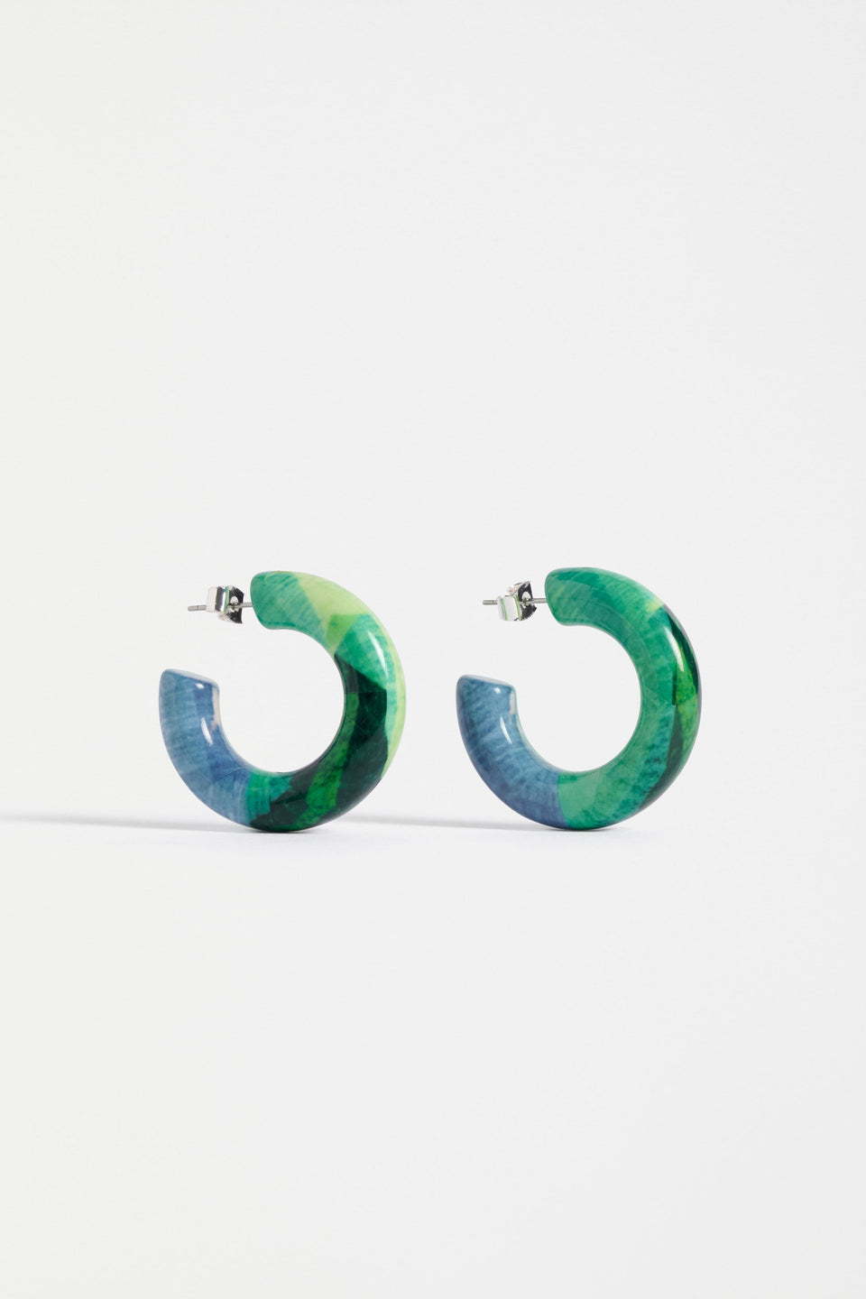The Resso Hoop Earring features a mid-sized open resin hoop with a contemporary silhouette and playful all-over printed design | GREEN KOMI PRINT