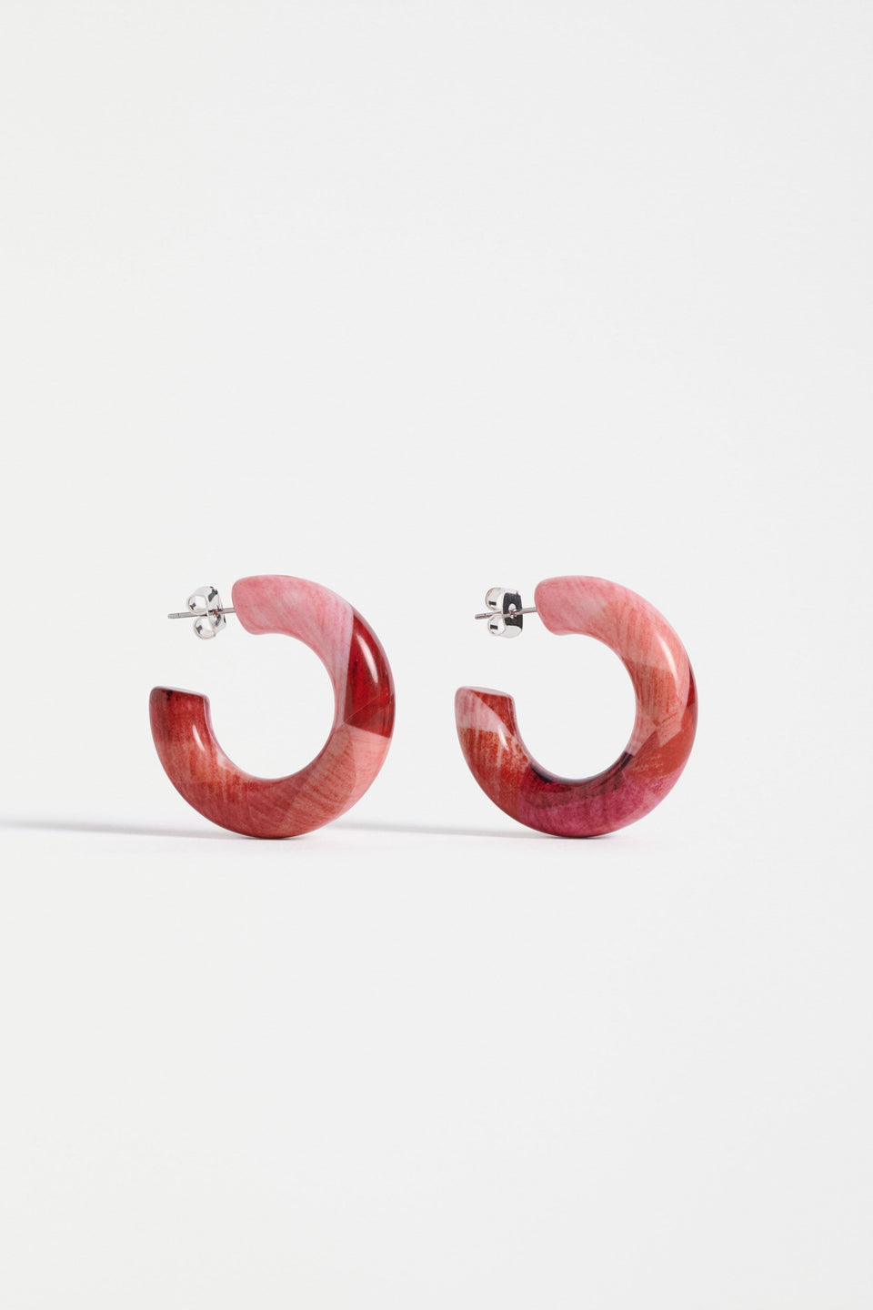 The Resso Hoop Earring features a mid-sized open resin hoop with a contemporary silhouette and playful all-over printed design | FUSCHIA KOMI PRINT