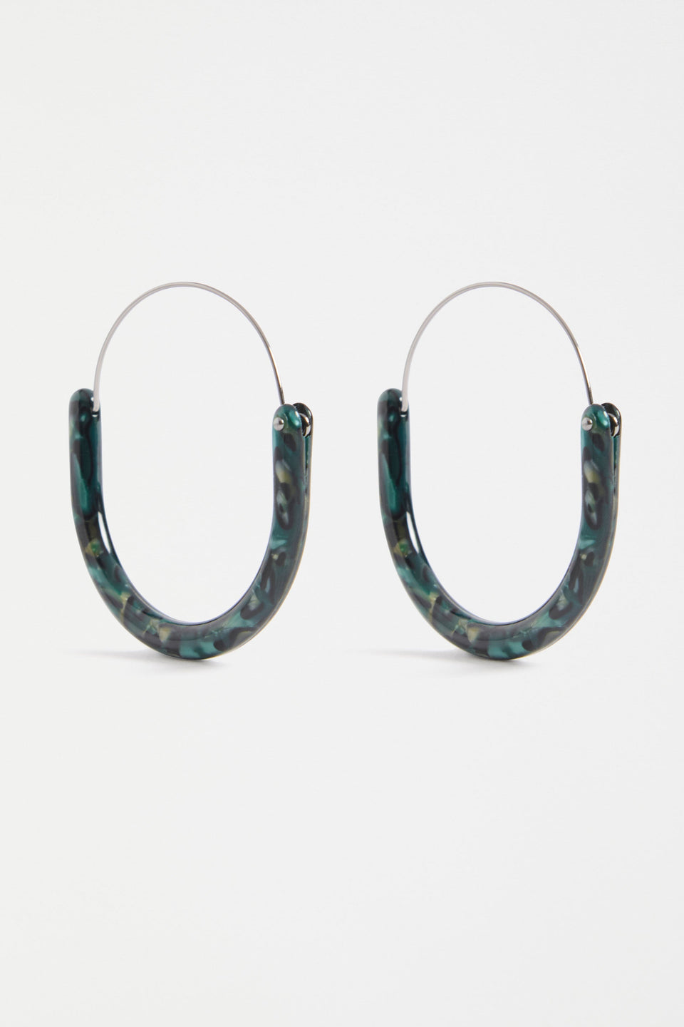 The Aki Hoop Earring features a large oval silhouette with layered acetate and a wire centre, offering a lightweight, modern statement | DARK GREEN TORTOISESHELL