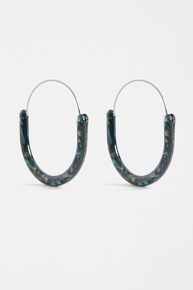 The Aki Hoop Earring features a large oval silhouette with layered acetate and a wire centre, offering a lightweight, modern statement | DARK GREEN TORTOISESHELL