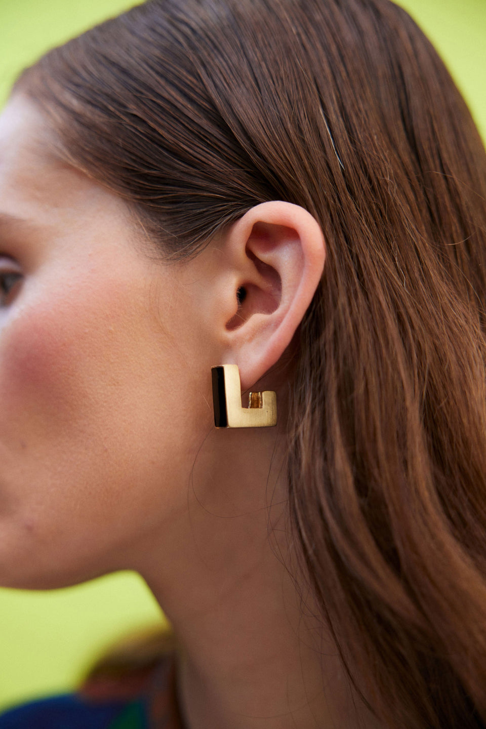 Anas Small Chunky Lightweight Metal and Enamel Square Stud Hoop Earring campaign Model crop | BLACK