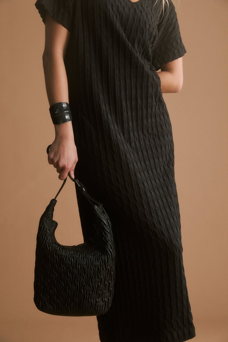 Orta Boxy Textured bubble Jersey Organic Cotton V-neck Long T-shirt Dress campaign Model front crop | BLACK