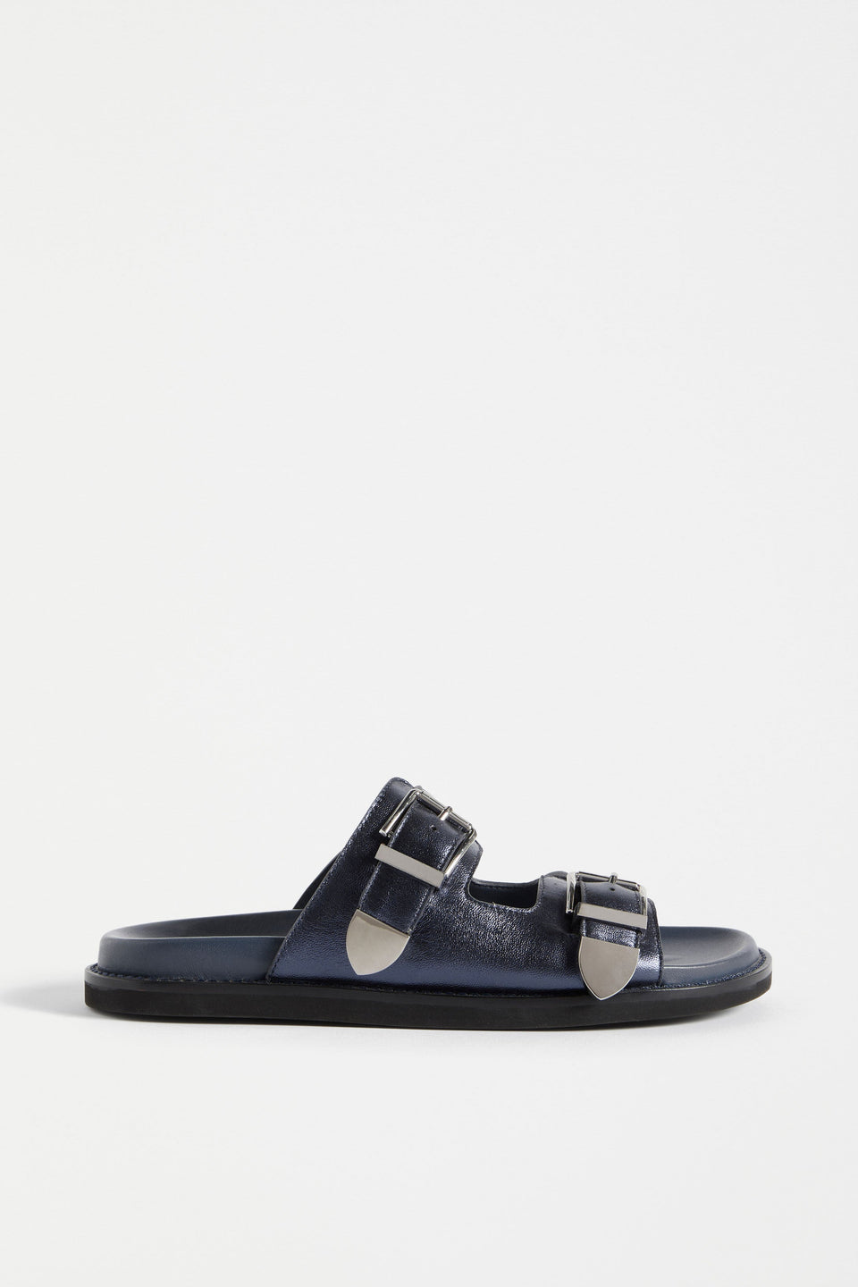 The Spenne Sandal features dual buckled foiled leather straps with tonal western hardware in a metallic slide design ELK | NAVY