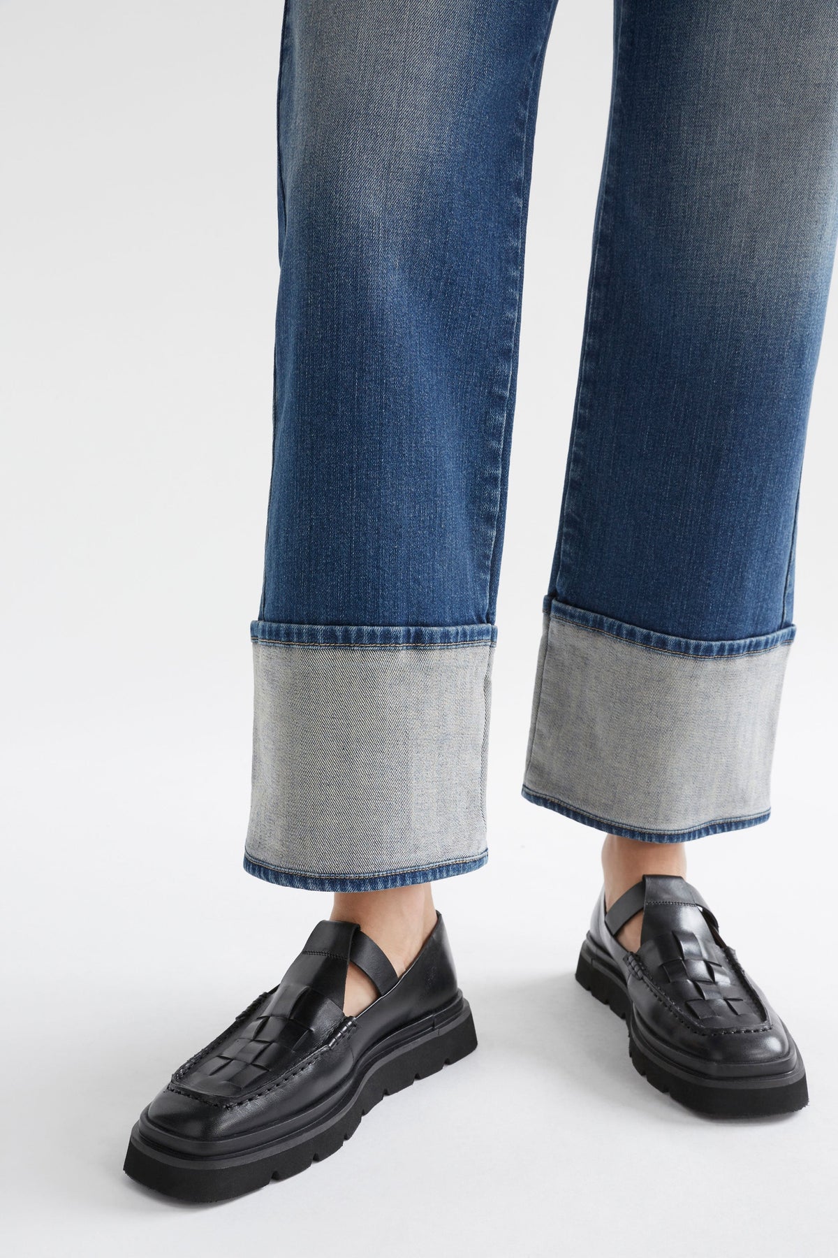 Modell Wide Straight Leg Organic Cotton Stretch Cuff Jean Model Front Cuff Detail | FADED INDIGO