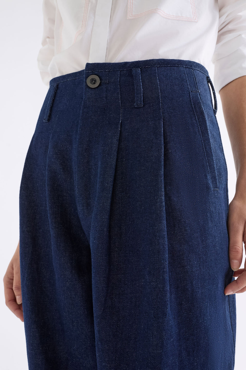 Decla Jean on Model Close up of pleat button detail | DARK BLUE WASH