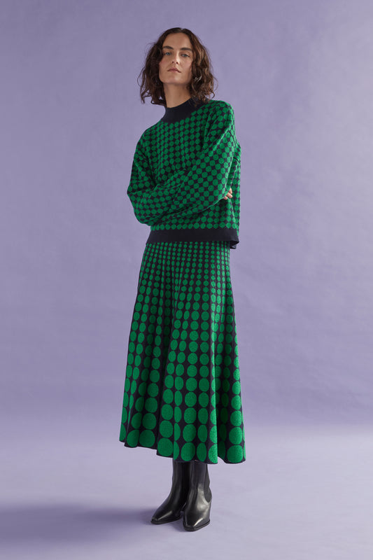 Leira Mock Turtle Neck Dropped Sleeve Metallic Circle Knit Sweater Model campaign Front | NAVY GREEN METALLIC