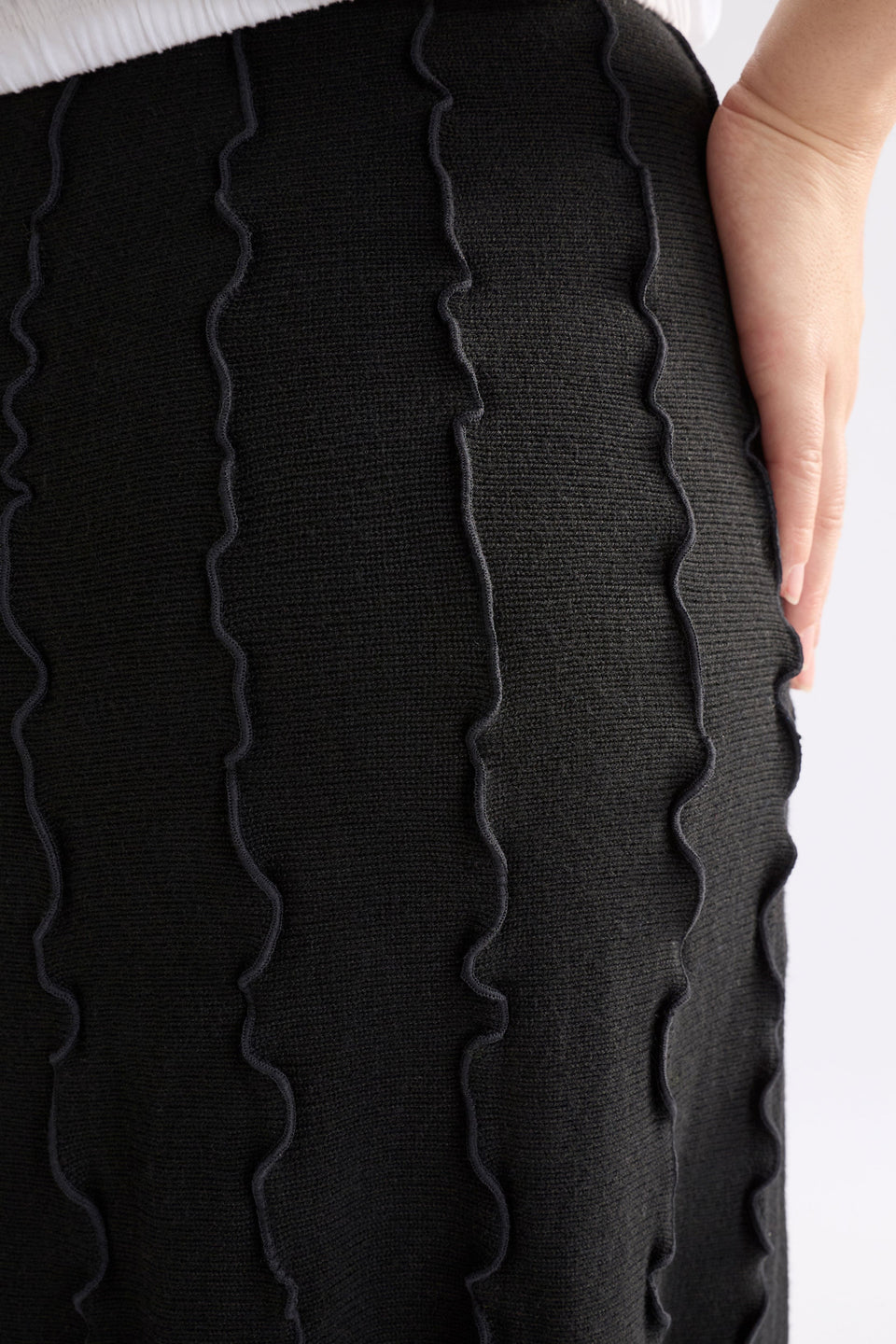 Musse Merino Wool Blend Knit Midi Skirt with Wiggle Textured Stripes Model Front detail | BLACK