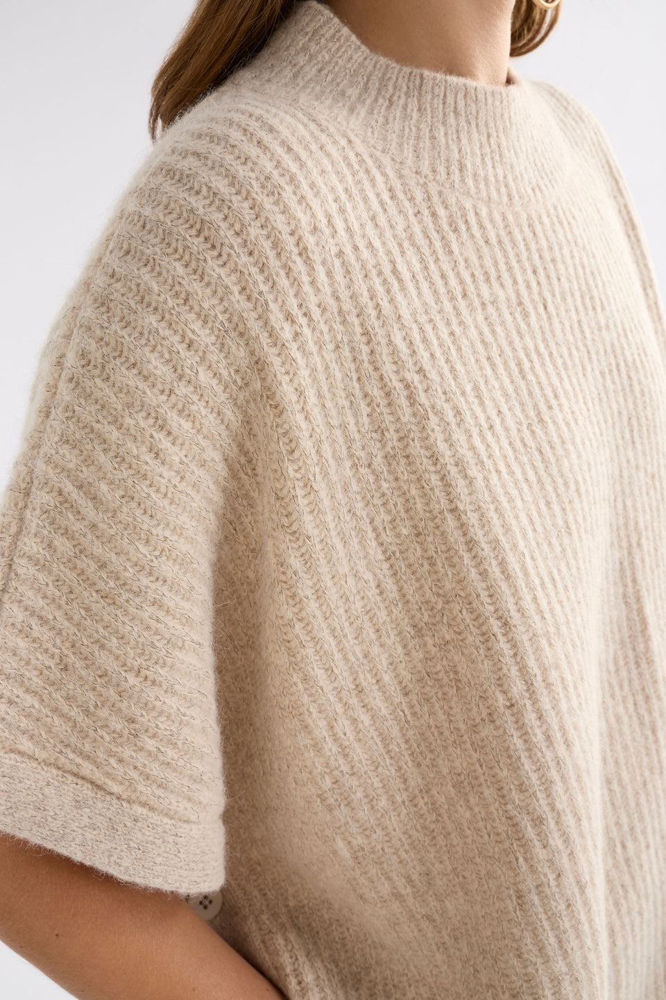 Kaanto Boxy Funnel Neck Rib Stitch Alpaca-Merino Wool Poncho Model Front detail | LATTE