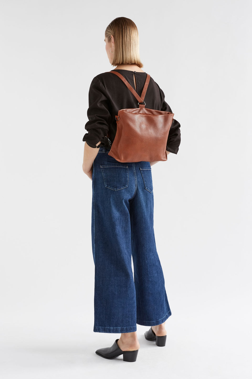 Nuoli Mini Leather Transformable Backpack to Crossbody Bag Full Body on Model | TAN