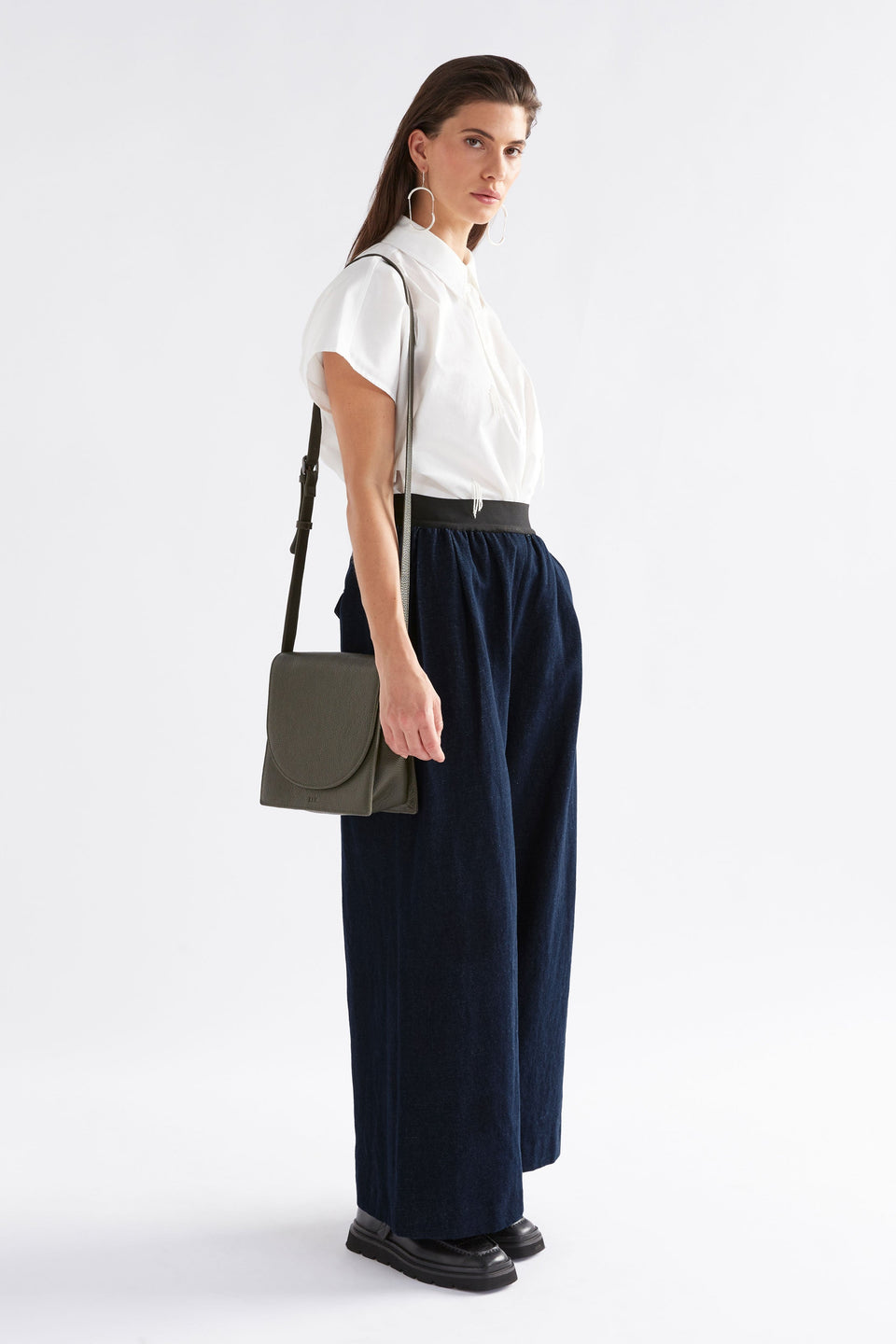 Sejer Structured Leather Crossbody Bag with Flap Closure Front Model full body | OLIVE