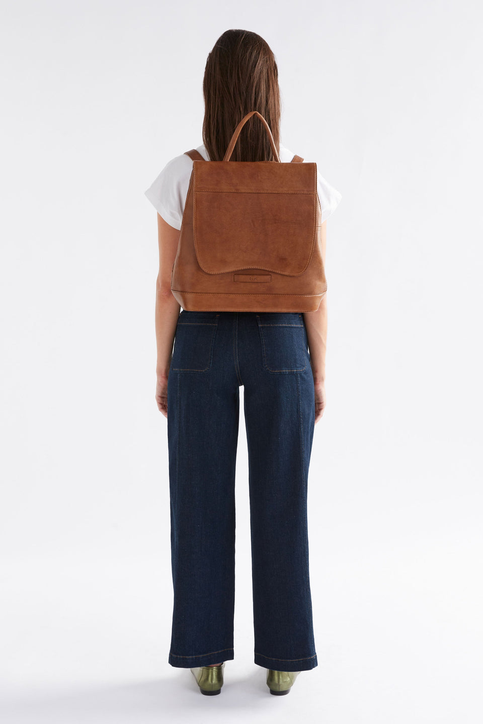 Forpa Zip-Up and Flap Leather Backpack Model on back | TAN