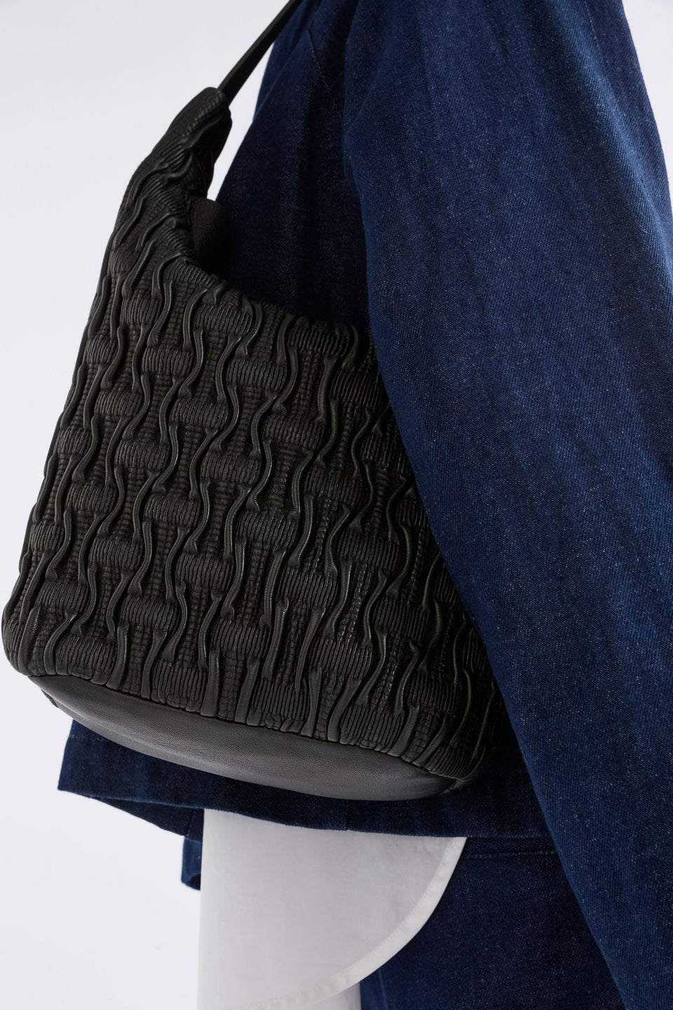 Lumme Smocked Leather Small Shoulder Bag on model crop | BLACK