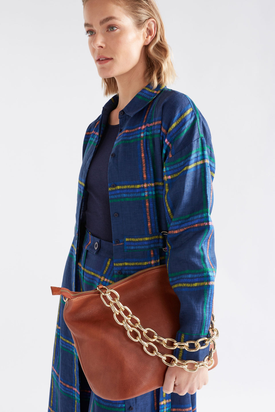 Lenkka Bag on model styled with print and gold chain strap | TAN