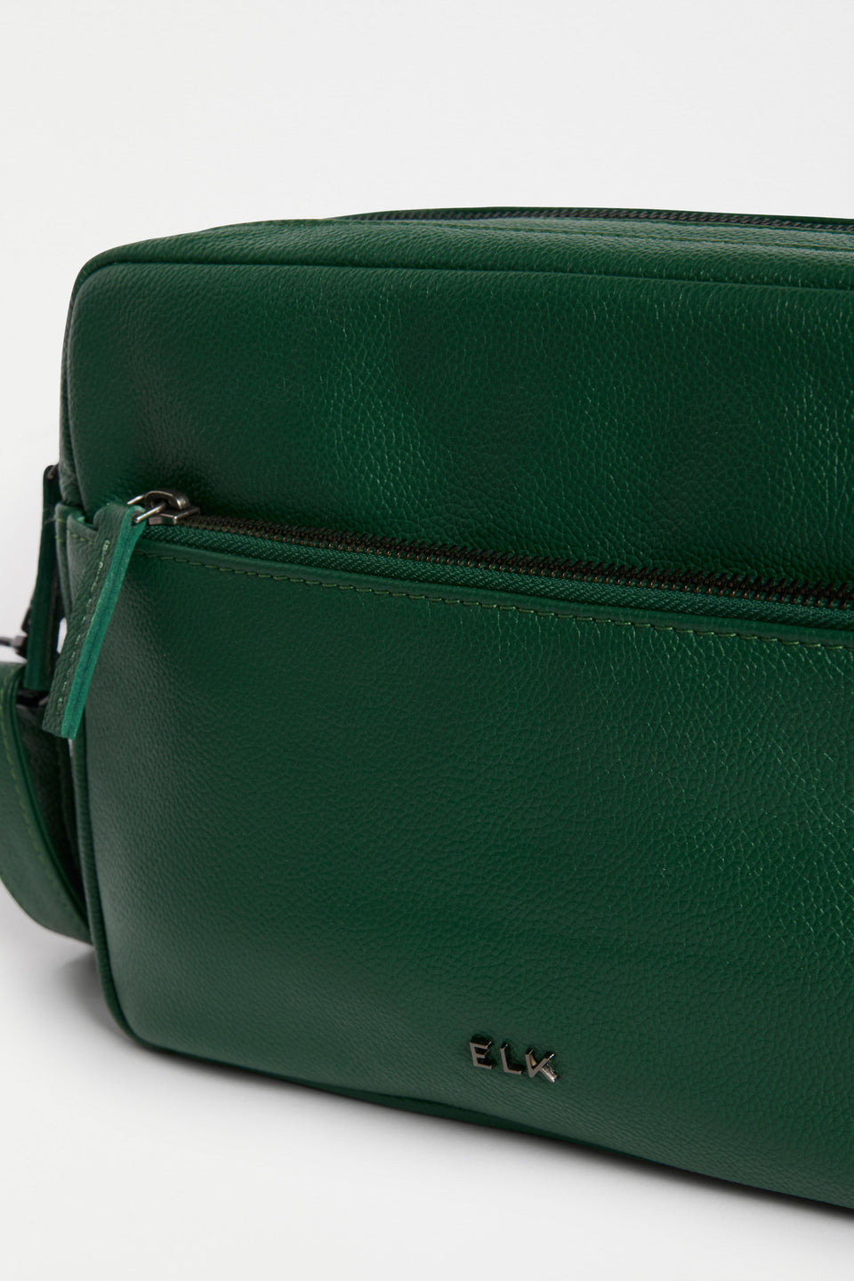 Olvi Crossbody Bag Flat Lay with zip pocket and elk logo | MILAN GREEN