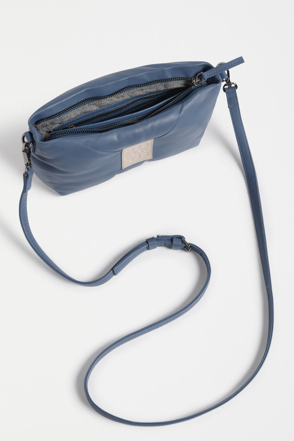 Moln Clutch Bag Flat Lay inside pockets with long strap | DENIM