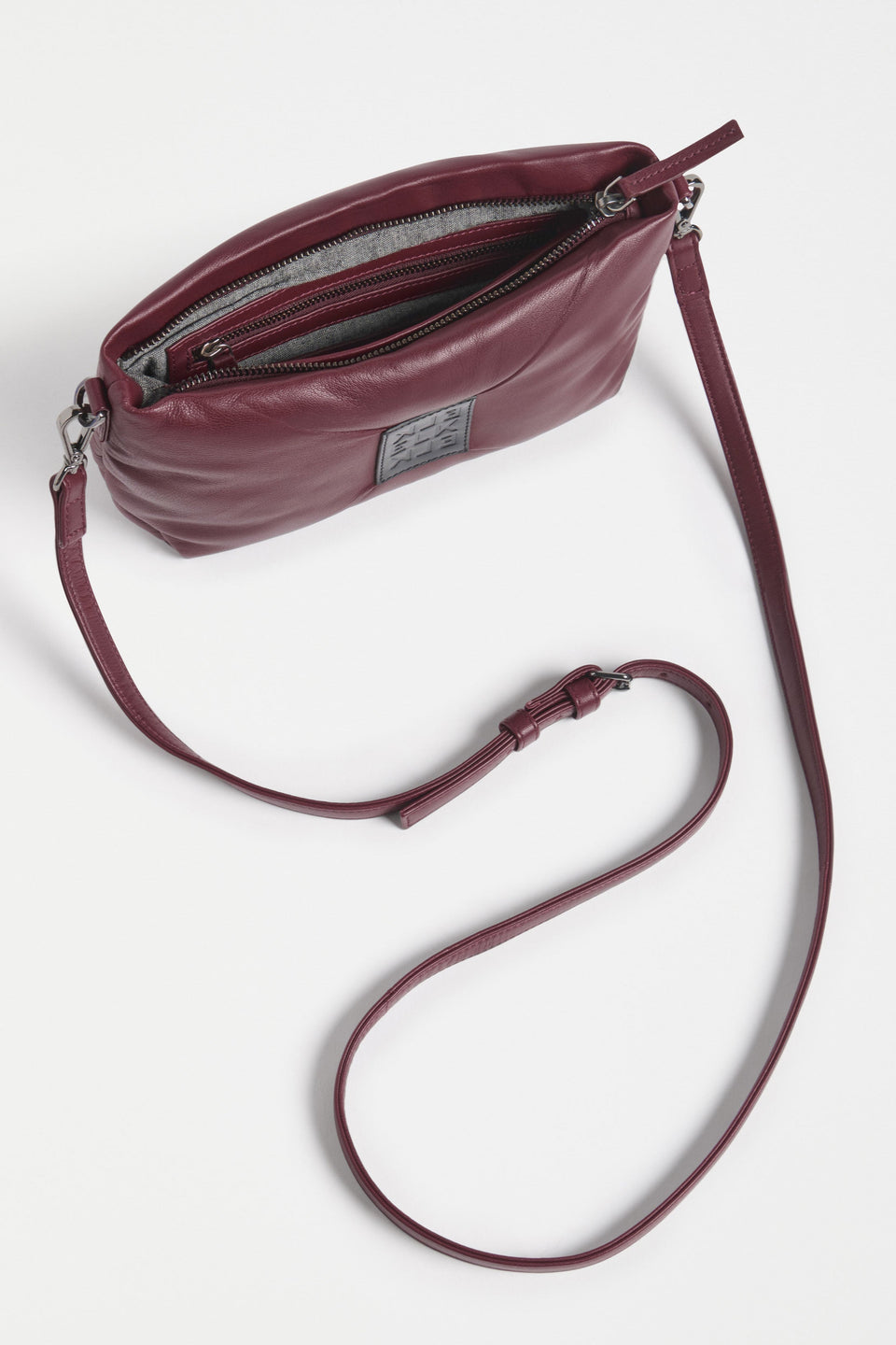 Moln Clutch Bag Flat Lay inside view with strap | BURGUNDY