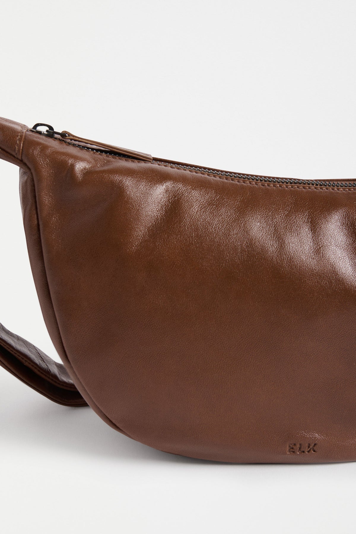 Junn Mini Bag Flat Lay close up elk logo | TAN