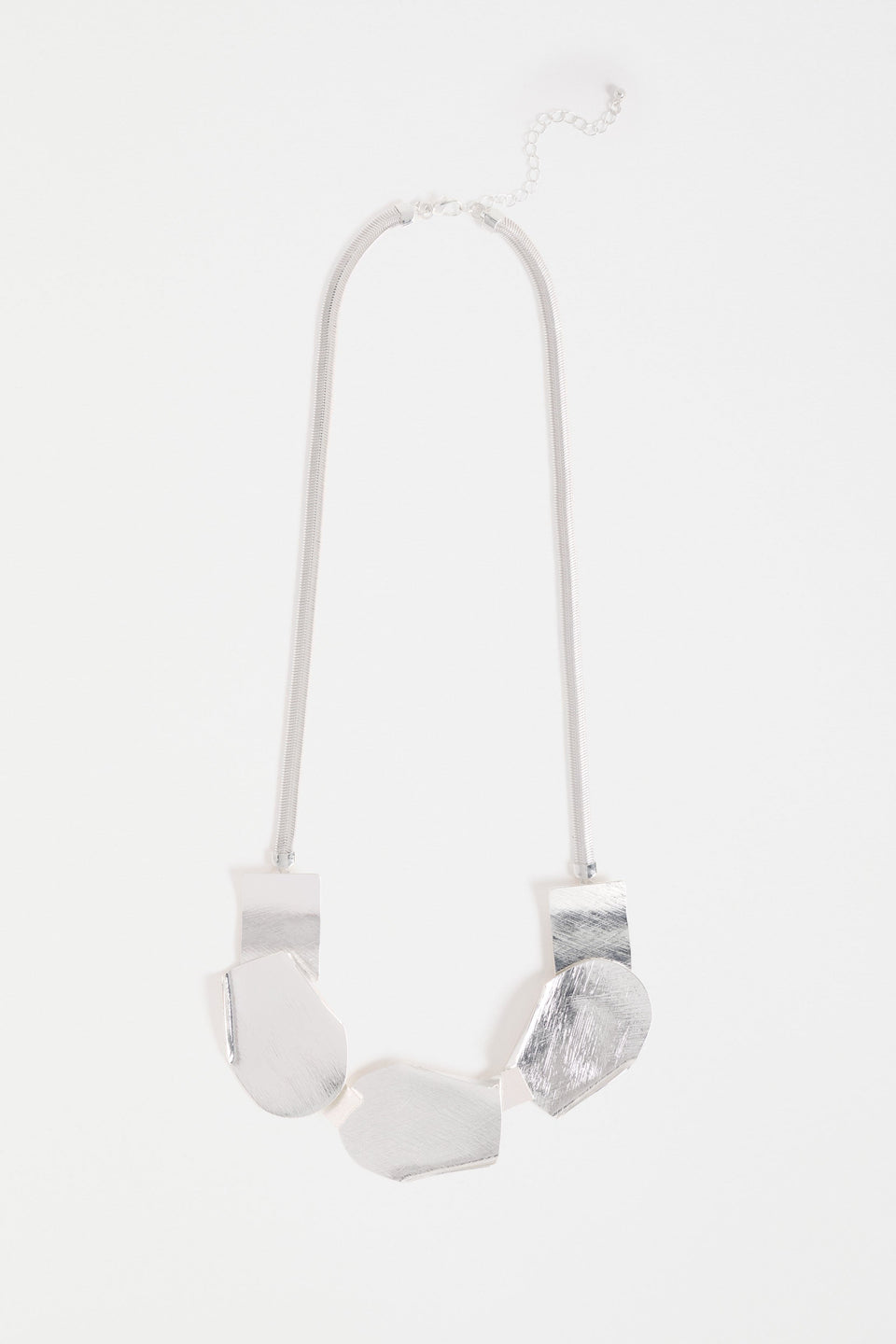 Villt Necklace features sculptural metal shapes with subtle folds and a brushed crosshatched finish for bold, artistic impact ELK | SILVER