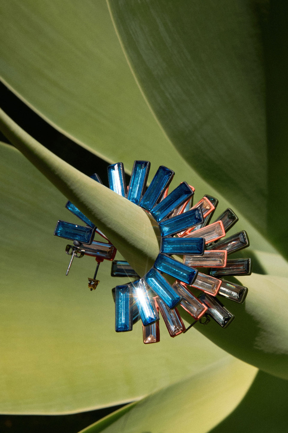 The Jule Large Hoop Earring features a circular fan of tonal glass beads radiating from a large hoop for a fun, glistening statement ELK campaign | PEACH