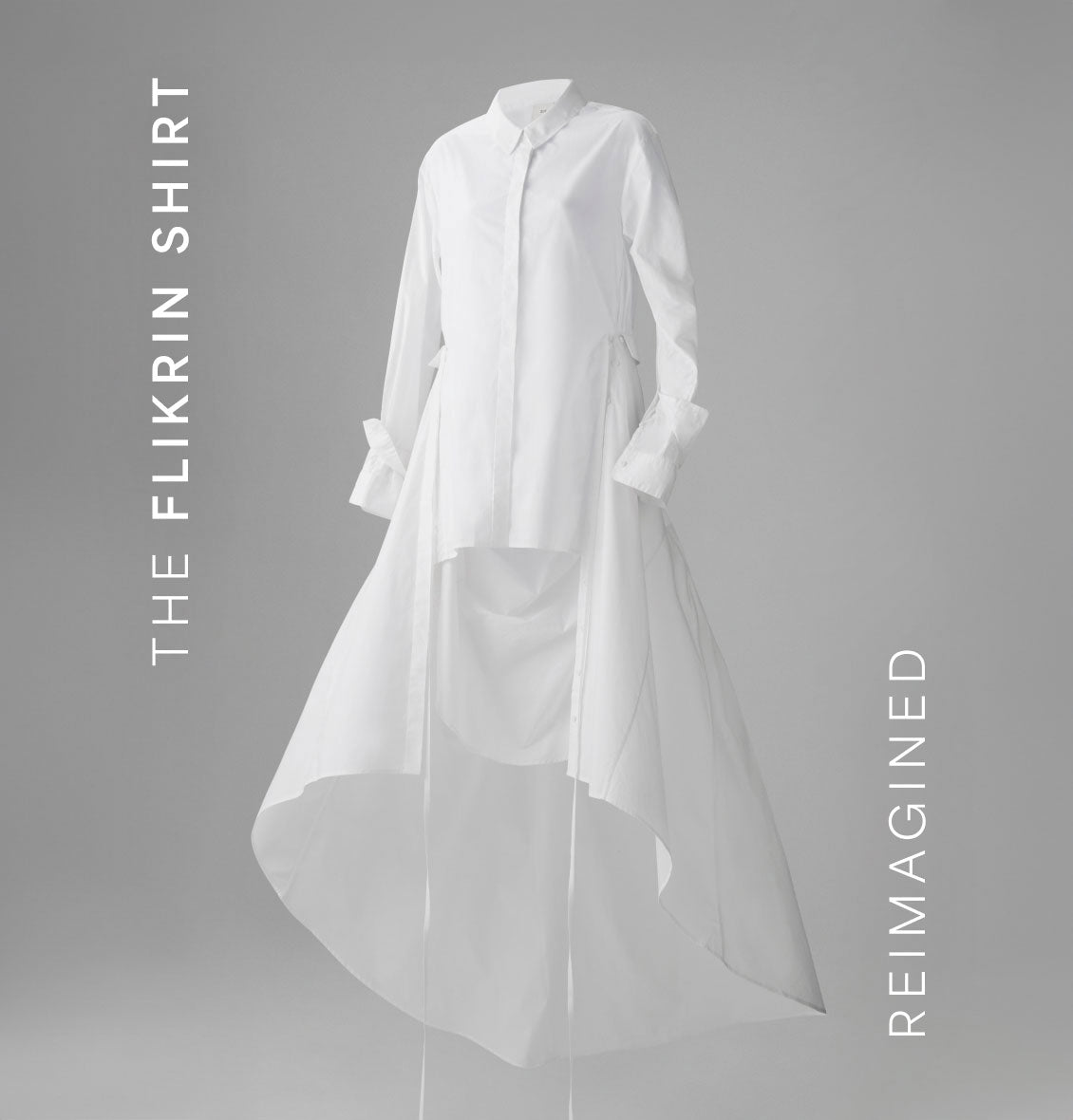Reimagined Flikrin shirt in crisp white with a flowing high-low hemline, tailored long sleeves, and minimalist button-down design