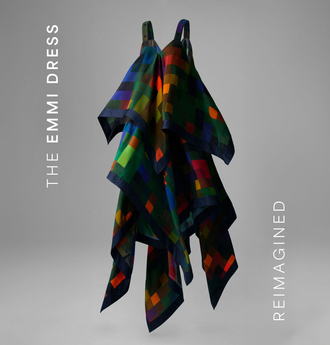 Reimagined Emmi Dress with vibrant geometric patterns and flowing layers, offering a bold, artistic touch to modern fashion