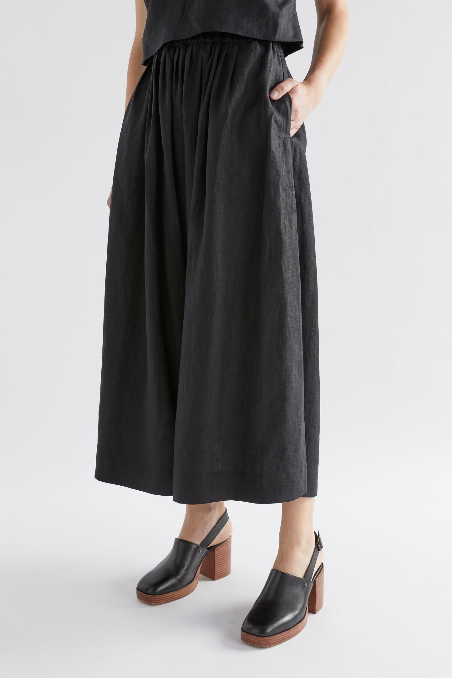 Elev Mid Length Gathered Elastic Waist Linen Skirt Model Angled Front | BLACK