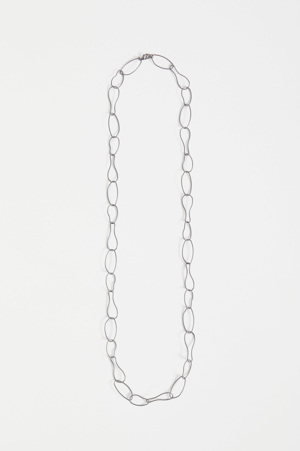 Niika Fine Organic Shaped Chain Coated Metal Necklace Flat | GUNMETAL