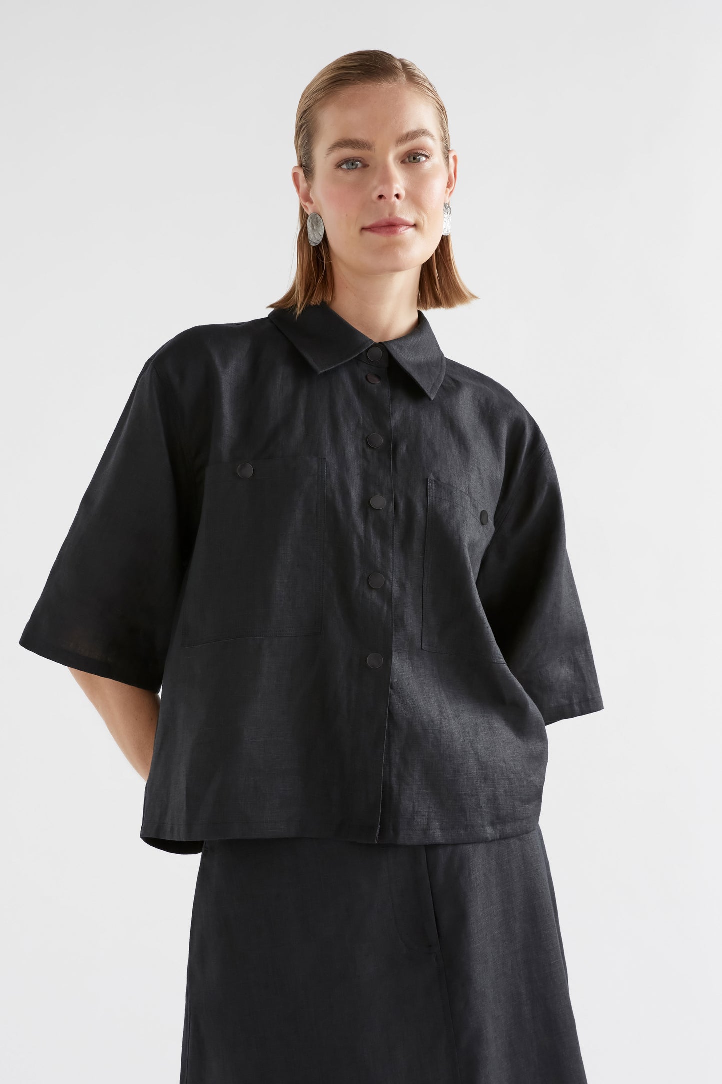 Nayte Boxy Relaxed Wide Short Sleeve Linen Shirt Model Front Crop | BLACK