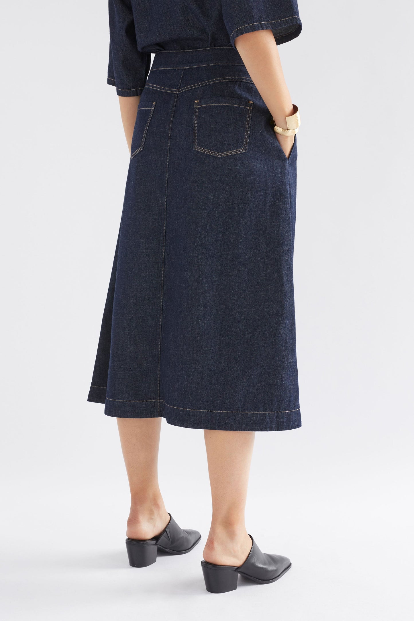 Denym A-line Midi Skirt Model Angled Back | AUTHENTIC BLUE WASH