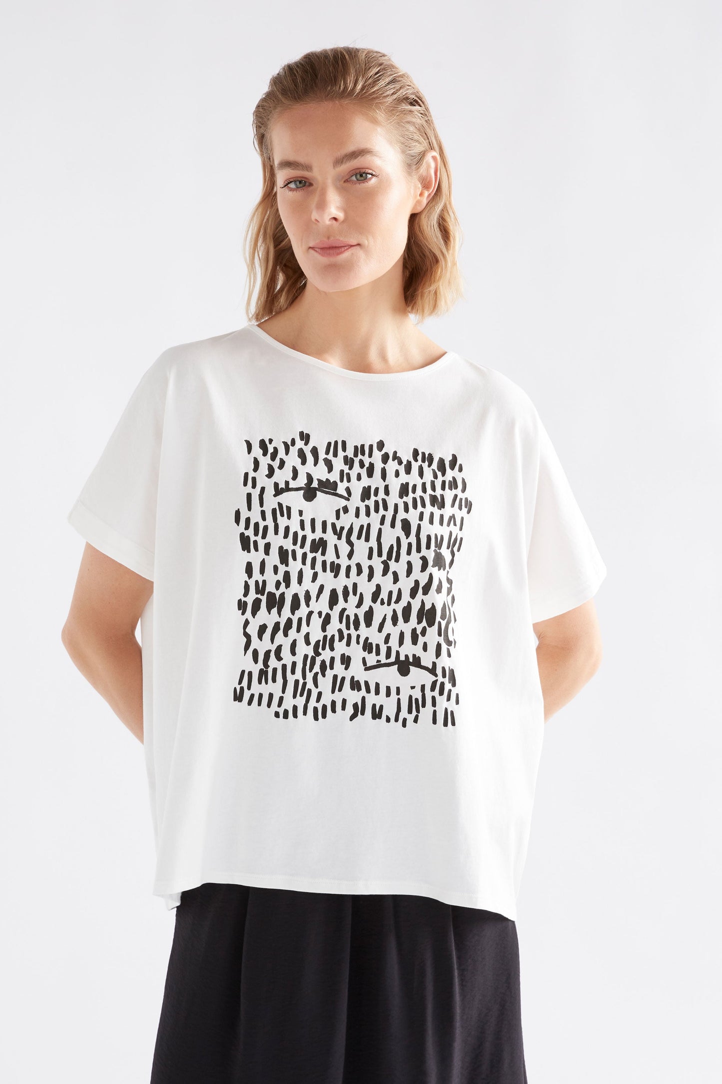 Bruk Brush Stroke Placement Print Organic Cotton Tee Model Front | BLACK TROPEA PLACEMENT PRINT