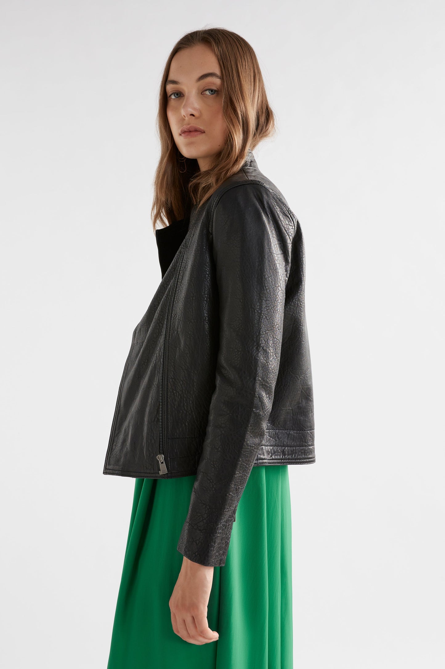 Deili V-Neck Flutter Sleeve A-line Dress Model side with Lader Leather Jacket | JEWEL GREEN