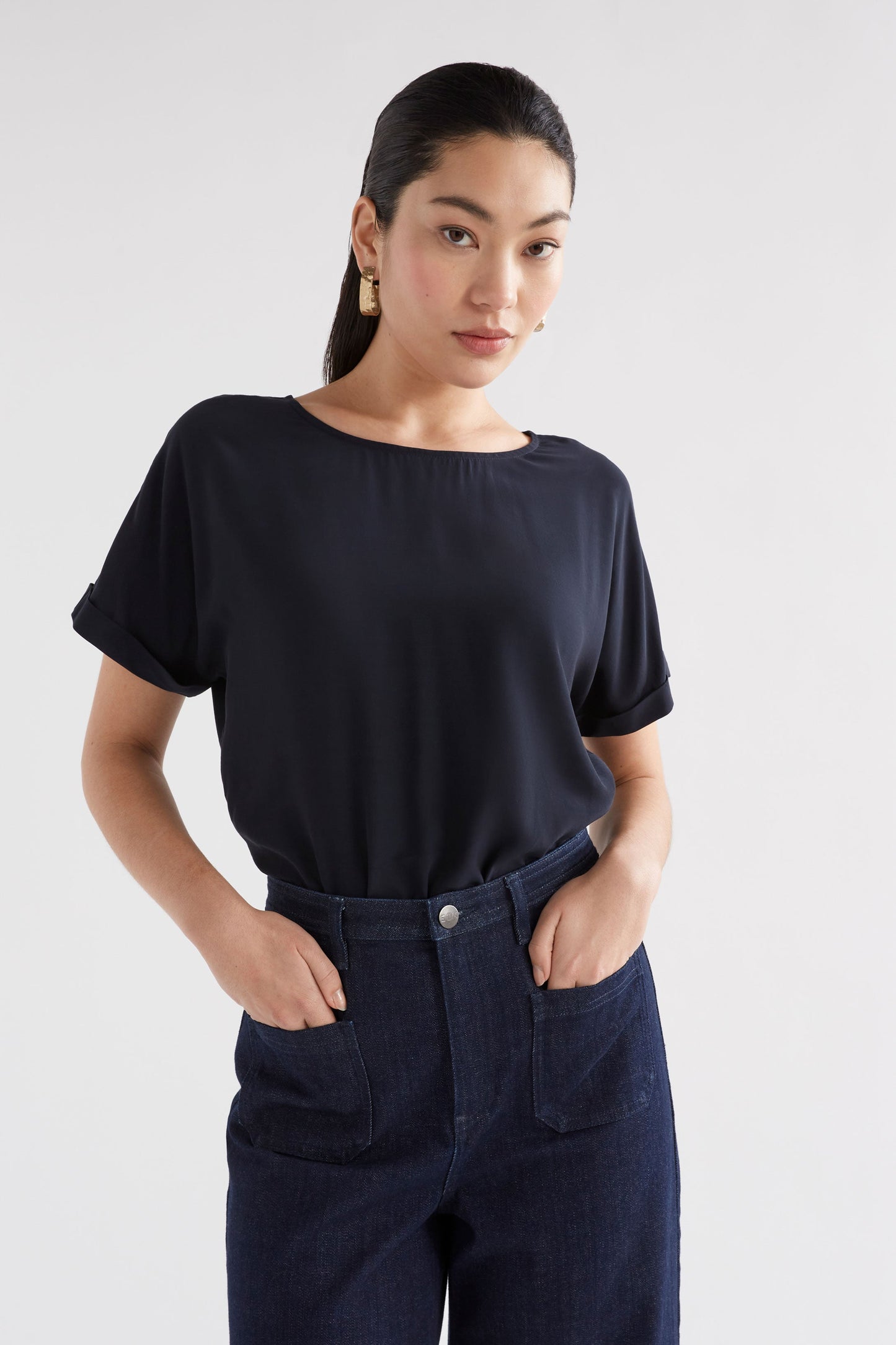 Eryn Silky-Feel Rolled Sleeve Short Sleeve Top Model Front Crop | SPACE BLUE