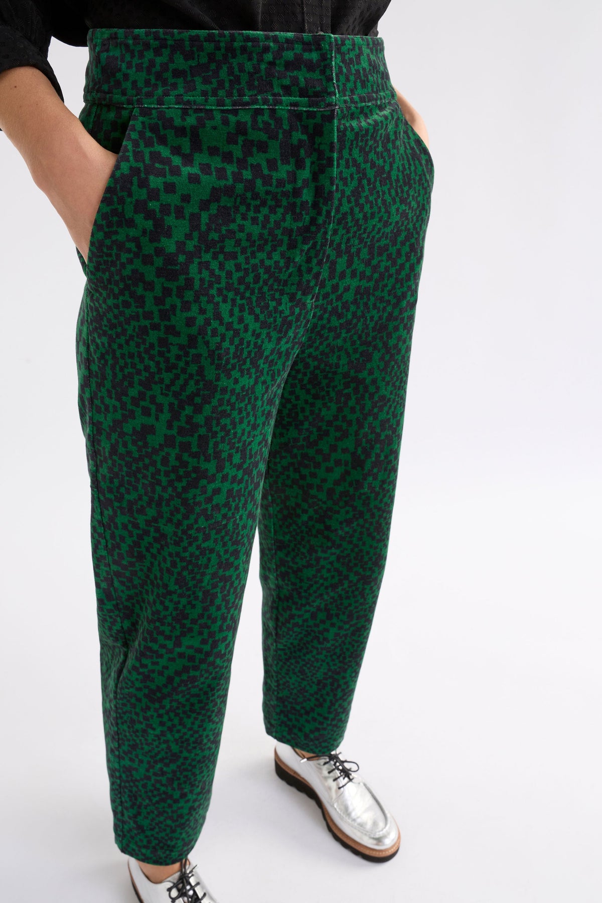 Atles High Waisted Tapered Leg Dark Green Pattern Cut Cord Pant Model Front detail| GREEN SINDA PRINT