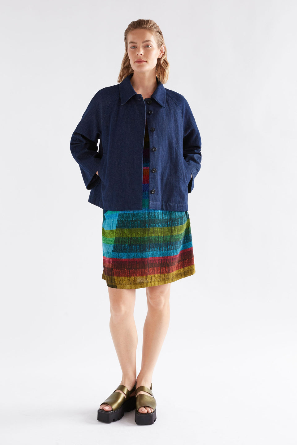 Sono Multi-coloured Stripe Print T-shirt Short Dress with Front Side Pockets Model Front with Jacket | KOMI PRINT