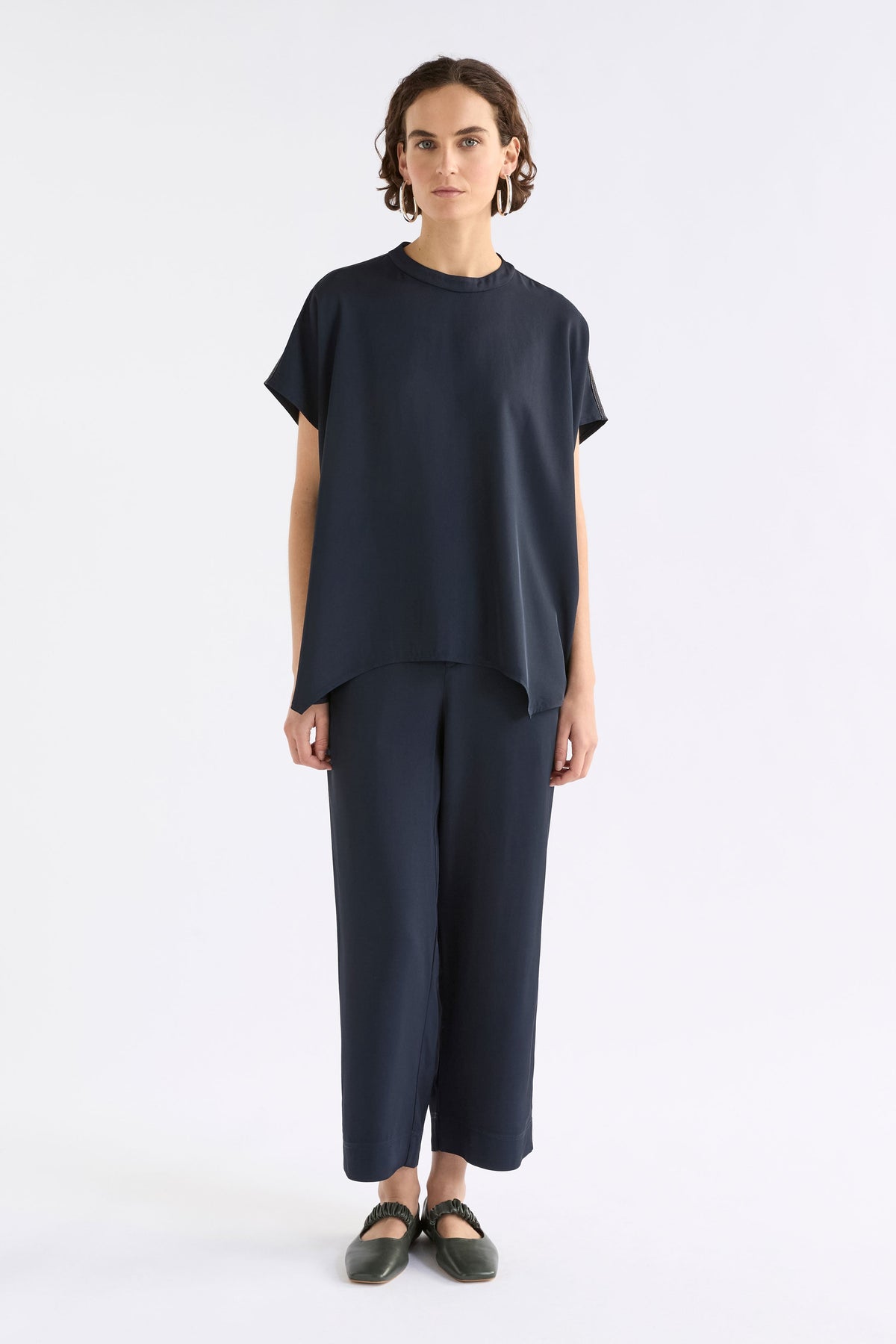 Hullu Relaxed Short Sleeve High Neck Top with Handkerchief Hem Model Front full body | NAVY