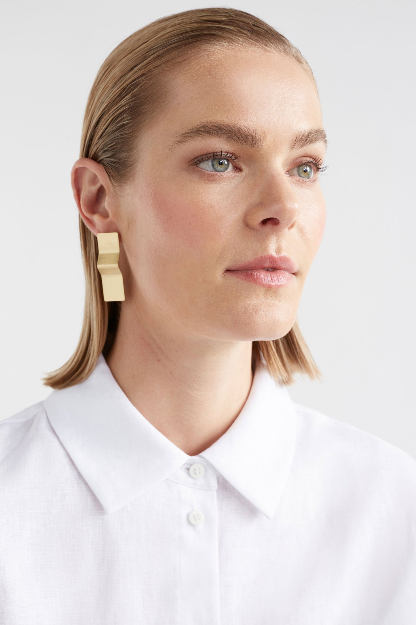 Saha Sculptural Metal Sheet Drop Earring model | GOLD